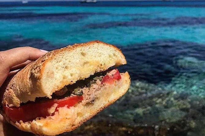 5 hour boat trip to Lampedusa with Sandwich, SUP and Snorkeling - Four or Five Swimming Stops Around Lampedusa