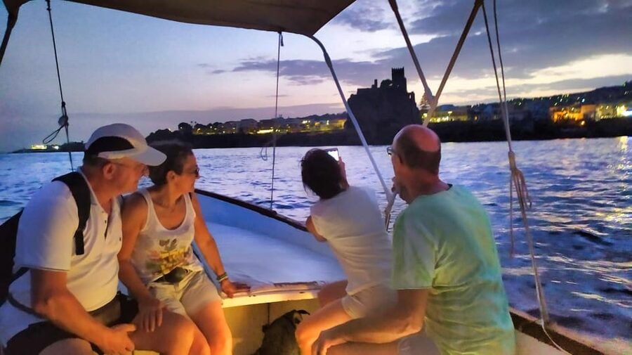 Aci Trezza boat tour sunset and dinner sicilian family home - Aci Castello from the water