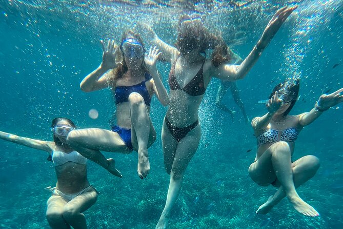 Boat tour to Egadi Favignana and Levanzo islands from Trapani - Cala Minnola ends the day in green water