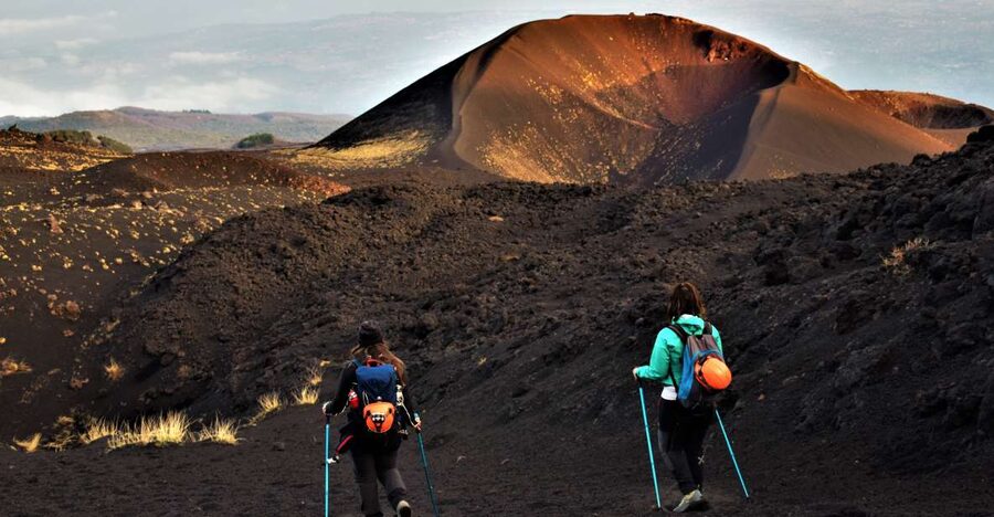 Catania: Etna Morning or Sunset Trek with Lava Tunnel & Gear - Walking across Etna’s craters and lava fields