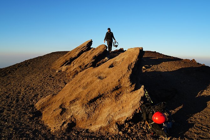 Catania: Mt. Etna sunset&wine experience - Entering a lava tube with helmets and flashlights