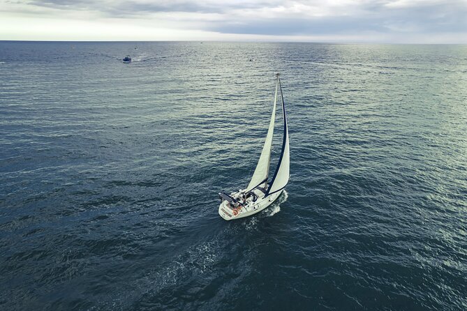 Catania: Sail Cyclops Coast by Boat and Enjoy a Sicilian Aperitif - A small boat outing from Catania
