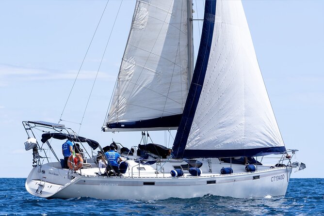 Catania: Sail Cyclops Coast by Boat and Enjoy a Sicilian Aperitif - Aci Castello, caves, and a castle above the water