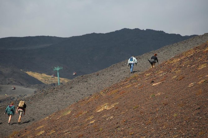 Etna & Alcantara Tour Experience - Entering a lava cave with supplied equipment