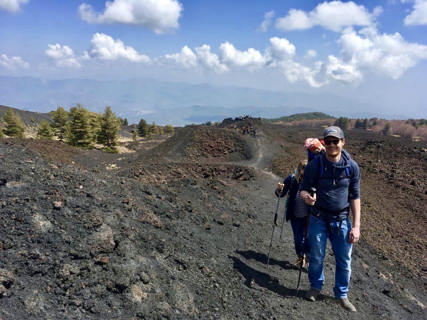 Etna: Craters of the 2002 Eruption Trekking Experience - Reaching the crater edges and looking toward Calabria