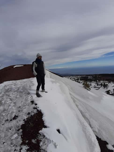 Etna: Jeep excursion and trekking suitable for everyone. Shoes and jacket provided free of charge. - Entering Grotta delle Nevi