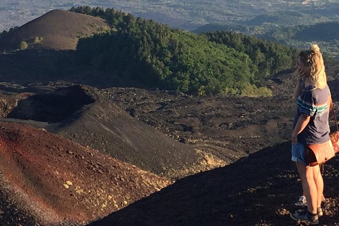 Etna Sunset Tour (starting from Catania) - Entering a lava cave with a helmet and torch