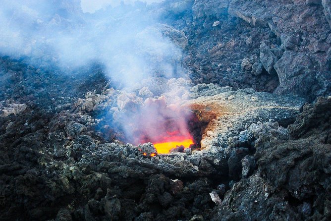 Etna & Taormina from Catania - Inside a volcanic cave with a helmet and torch