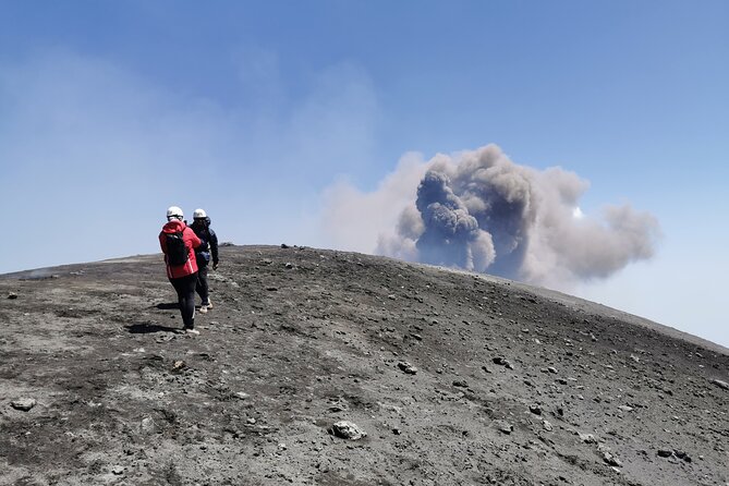 Excursion on the summit craters of Etna, with cable car and 4x4 bus - Hiking across fresh lava and black volcanic ground