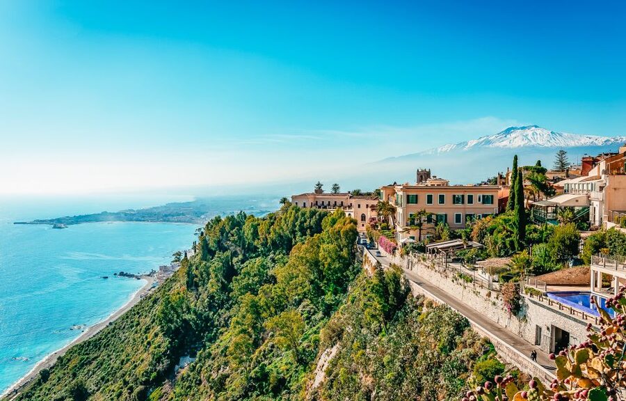 From Catania: Day Trip to Mount Etna and Taormina - Entering a lava cave with a helmet and torch
