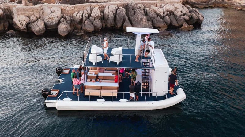Giardini Naxos: Dolphin Catamaran Sunset Tour with Aperetif - Grottos, headlands, and Taormina’s famous bays