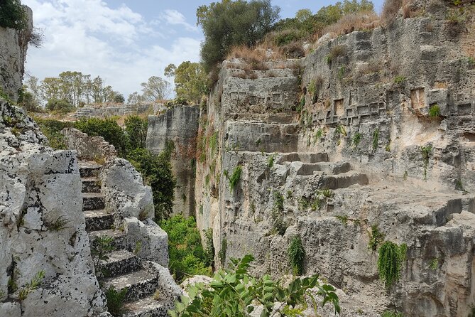 Group guided tour of the archaeological park of Neapolis - Latomia del Paradiso: an old quarry turned garden walk