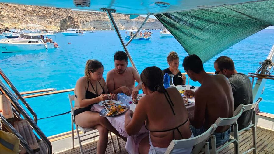 Lampedusa: Yacht excursion, swimming stops and typical lunch - Two hours around Rabbit Island