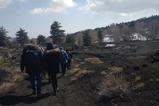 Mount Etna Half-Day Small Group Tour from Taormina - Entering a lava cave with helmet and flashlight
