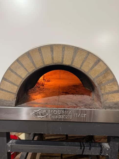Palermo: Pizza & Tiramisu Class with Free Flowing Fine Wine - Putting on the apron and starting with dough
