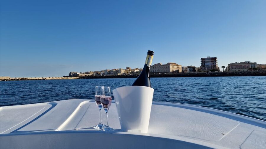 Siracusa: Ortigia & Sea Caves Boat Tour with Sunset Apertif - Leaving Ortigia and seeing the island from offshore