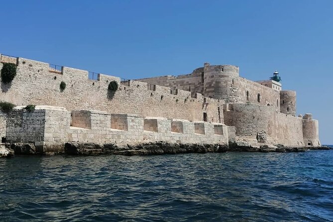Syracuse Boat Excursion with Snorkeling to the Sea Caves - The castle-side swim stop