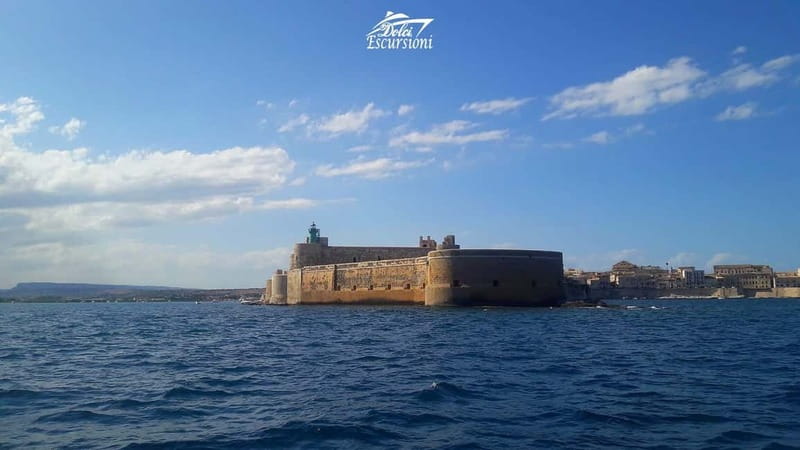Syracuse: Boat Trip with Lunch, Wine, and Swimming Stops - The meal, drinks, and onboard pace