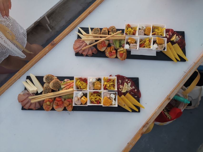 Syracuse: Ortigia Sunset Cruise with Aperitif - Capuchin Cove and the First Cave