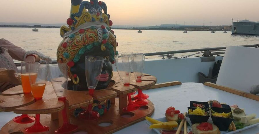 Syracuse: Ortigia Sunset Cruise with Aperitif - Red Coral Walls at Grotta del Corallo