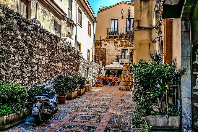 Taormina Private Walking Tour: Explore Top Sights & Hidden Gems - The Ancient Theatre and the view toward Mount Etna