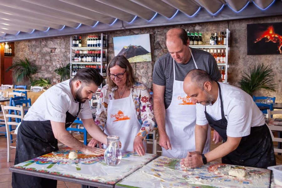 Taormina: Sicilian Cooking Class w/ a Visit to Local Market - Sitting down to eat what you made