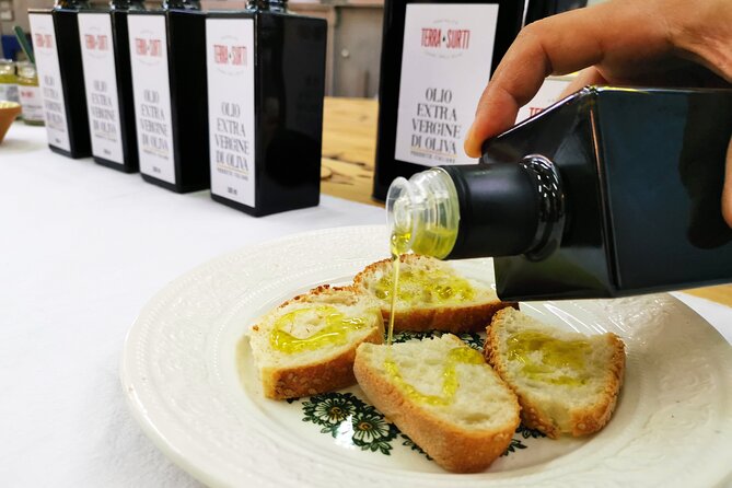 Visit to the olive grove, oil tasting and lunch at the farm - The tasting table: bruschetta, pesto, and local specialties
